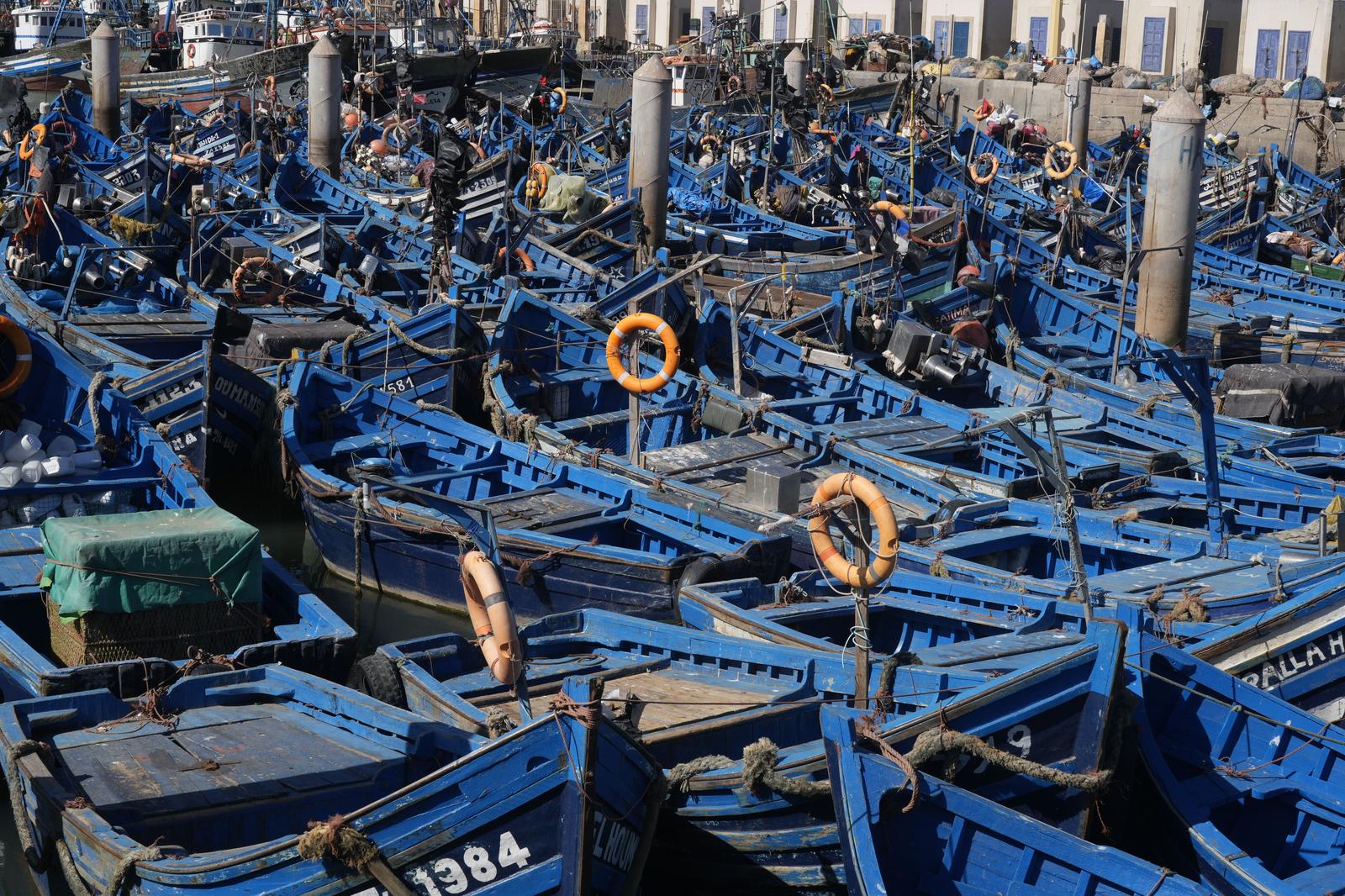 Blue fishing boats at port